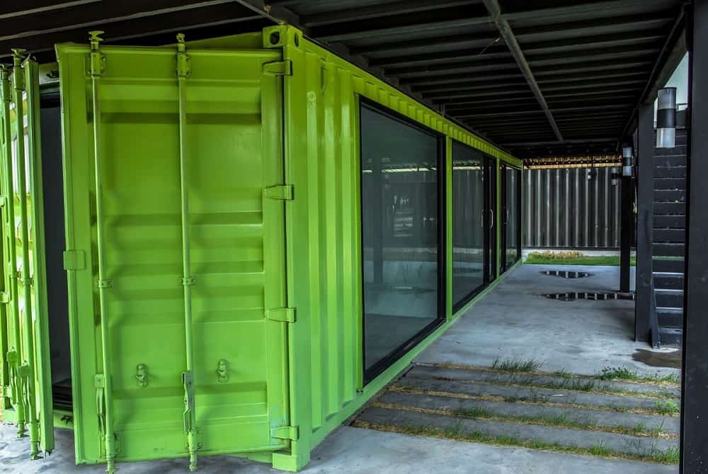 Container with full-height glass sliding wall